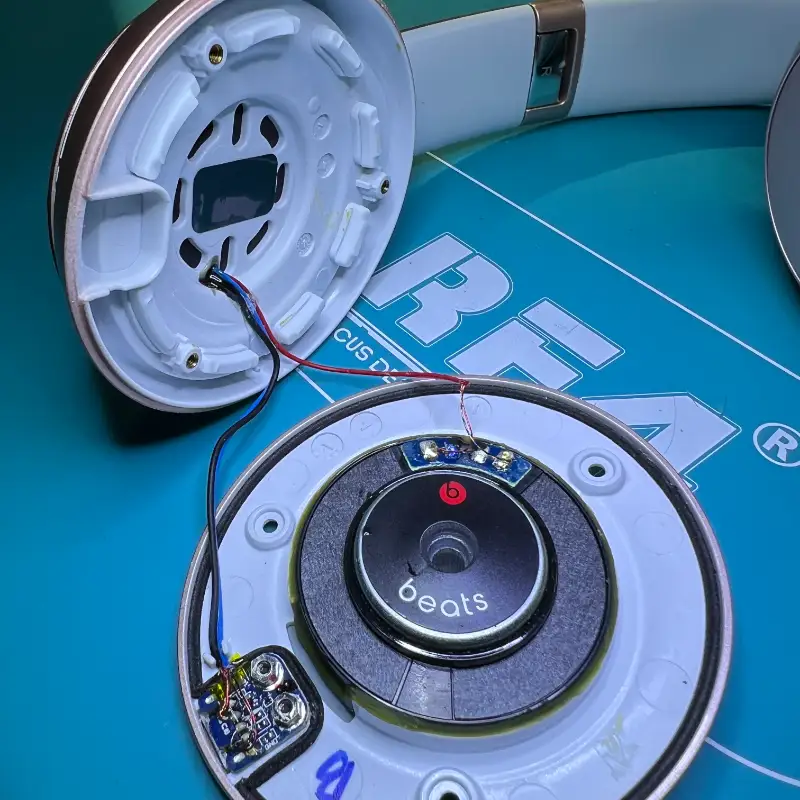 Beats headphone microsoldering repair showing internal circuit board and driver components at Seki Gadgets professional audio repair workshop in Canberra ACT