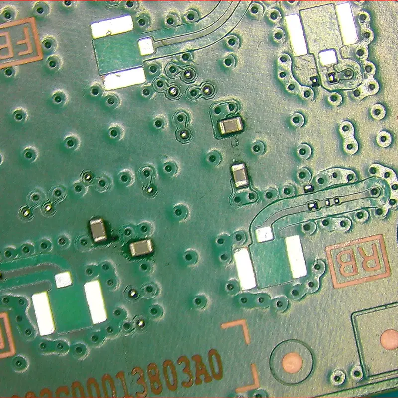 PS5 motherboard prepared for coaxial connector replacement with damaged parts removed