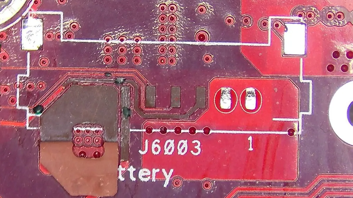 Damaged battery connector torn from the J6003 socket on an ASUS ROG Ally X motherboard at Seki Gadgets Canberra