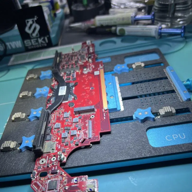 ASUS ROG Ally X motherboard secured in the PCB rework station at Seki Gadgets Franklin workshop